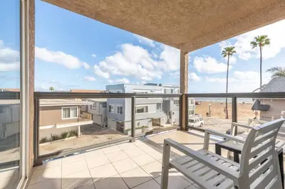 a view from the balcony of a house with a chair at Christopher - Oceanview in Newport Beach