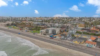 an aerial view of a beach with houses and condos at The Shining Sea Octopus in Oceanside
