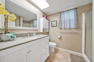 a bathroom with a sink and a toilet and a mirror at 3607 Seashore Dr A in Newport Beach