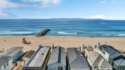 an aerial view of a beach with buildings and the ocean at 3607 Seashore Dr A in Newport Beach