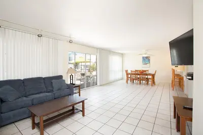a living room with a couch and a table at 3610 Seashore Dr in Newport Beach