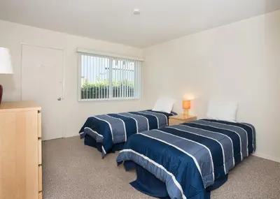 two beds in a room with a window at 3610 Seashore Dr in Newport Beach