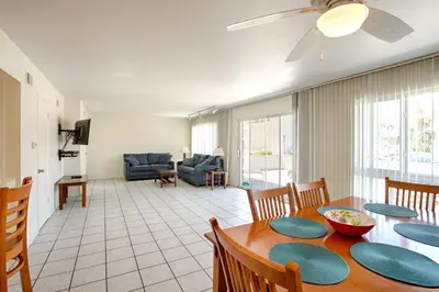a dining room and living room with a table and chairs at 3610 Seashore Dr in Newport Beach