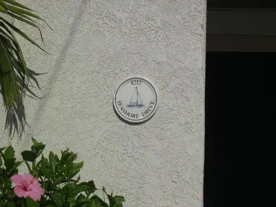 a sign on the side of a building with a ship on it at 4212 Seashore Dr A in Newport Beach