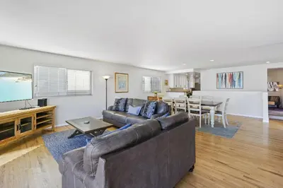 a living room with a couch and a table at 925 W Bay Ave in Newport Beach