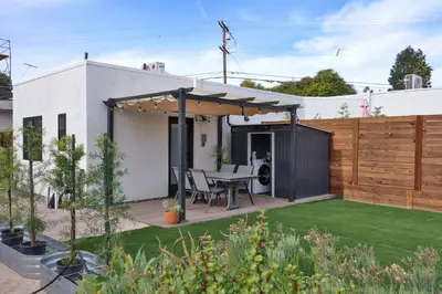 a patio with a table and a fence at Bungalow near zoo and beach with AC, EV, private yard in San Diego