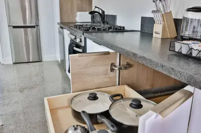 a kitchen with a wooden box with two pans in it at Bungalow near zoo and beach with AC, EV, private yard in San Diego