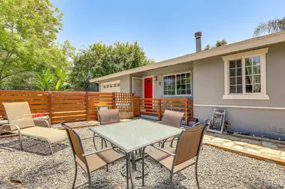 a patio with a table and chairs in front of a house at Peaceful Vista House with Gas Grill 1 Mi to Dtwn! in Vista
