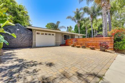 a home with a driveway and a garage at Peaceful Vista House with Gas Grill 1 Mi to Dtwn! in Vista