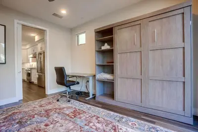 a home office with a large sliding barn door at Ocean-view home blocks to beach with private hot tub & rooftop deck in San Diego