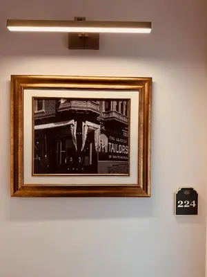 a framed picture of a train on a wall at The Beau Hotel Downtown San Diego Gaslamp Quarter in San Diego