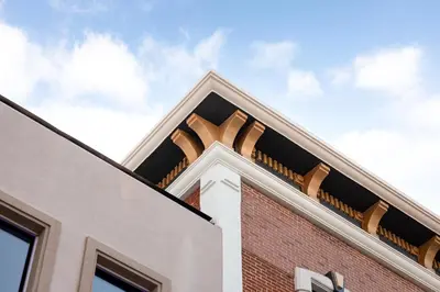 a corner of a brick building with architectural elements at The Beau Hotel Downtown San Diego Gaslamp Quarter in San Diego