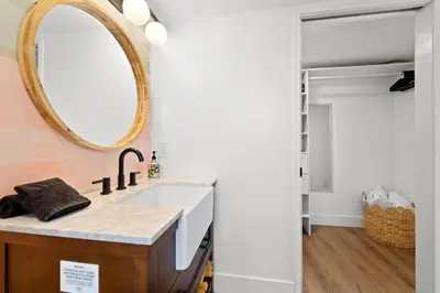 a bathroom with a sink and a mirror at Polk Casita by Rather Be Properties in San Diego