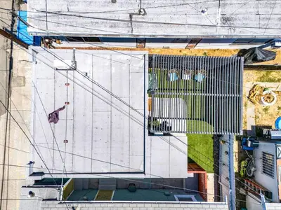 an overhead view of a building with a gate at Polk Casita by Rather Be Properties in San Diego