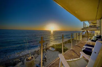 a view of the ocean from the balcony of a house at Oceanfront Getaway, Private Beach, Fire Pit, 5BR in Oceanside