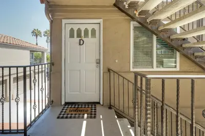 a house with a white door with the letter d on it at 1128 Tait Street, Unit D in Oceanside