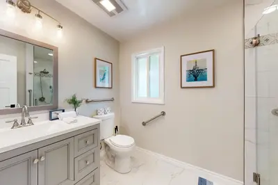 a bathroom with a sink and a toilet and a shower at Blue Oasis Cozy Home in San Diego