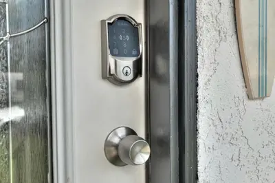 a close up of a door with a cell phone on it at Beachside Bliss Spacious 3BR Retreat, Steps to Ocean in Oceanside
