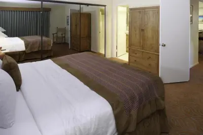 a large bedroom with two beds and a closet at Diamond Riviera Oaks Resort and Racquet Club 1BD in Ramona