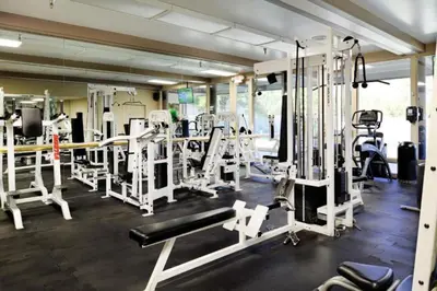 a gym with a lot of equipment in a room at Diamond Riviera Oaks Resort and Racquet Club 2BD in Ramona
