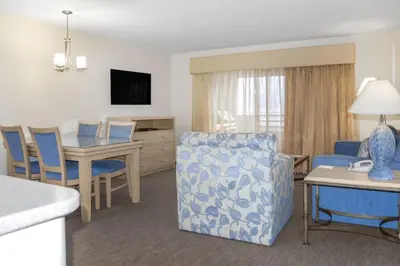 a living room with a couch and a dining room at Diamond - Riviera Beach and Spa Resort 1bd in Dana Point