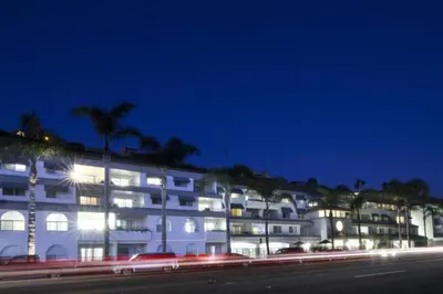 a building with cars parked in front of it at night at Diamond - Riviera Beach and Spa Resort 1bd in Dana Point