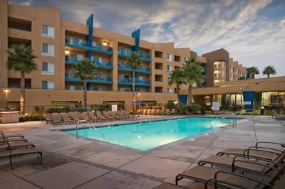 a pool at a hotel with chairs and a building at WorldMark Oceanside 2BD in Oceanside