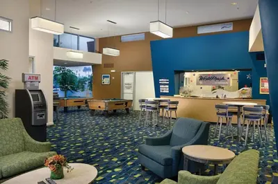 a lobby with tables and chairs and a pool table at WorldMark Oceanside 2BD in Oceanside