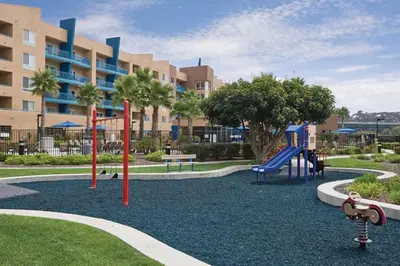 a playground in front of a large building at WorldMark Oceanside 2BD in Oceanside