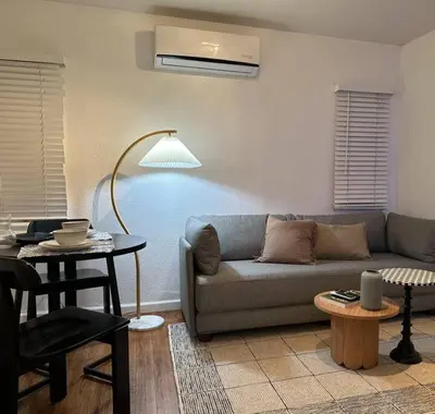 a living room with a couch and a table at Modern Eclectic 1BR by Downtown, Airport & More in San Diego