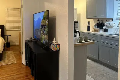 a kitchen with a flat screen tv on a counter at Modern Eclectic 1BR by Downtown, Airport & More in San Diego