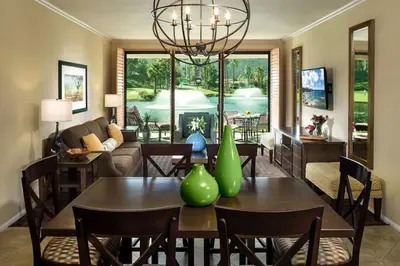 a living room with a table with vases on it at Hyatt The Welk 2BD in Escondido