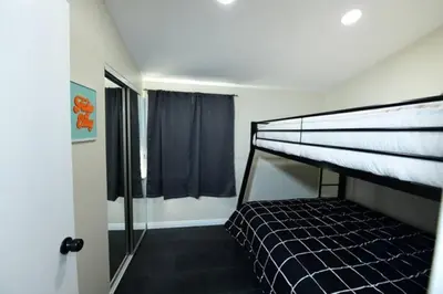 a bedroom with a bunk bed and a window at Sunny San Diego, Entire home, Pool, Free Parking, BBQ, Pets allowed, family neighborhood! in San Diego