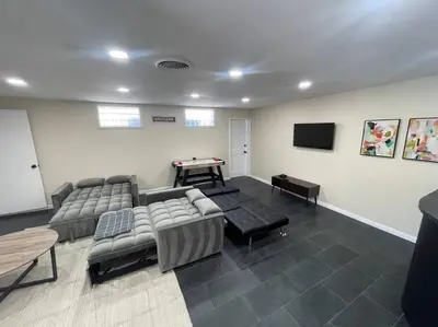 a living room with couches and a pool table at Sunny San Diego, Entire home, Pool, Free Parking, BBQ, Pets allowed, family neighborhood! in San Diego