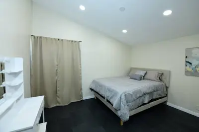 a white bedroom with a bed and a window at Sunny San Diego, Entire home, Pool, Free Parking, BBQ, Pets allowed, family neighborhood! in San Diego