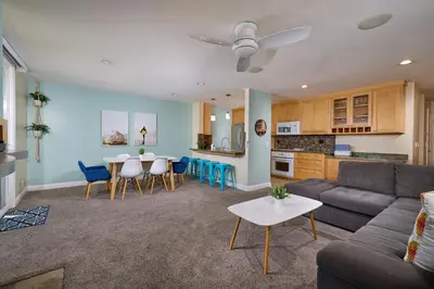 a living room with a couch and a table at Oceanside Beach Condos in Oceanside