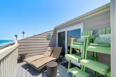 a deck with two chairs and a table and chairs at Picturesque Perfection in Leucadia in Encinitas