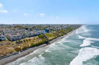 an aerial view of a beach with buildings and the ocean at Picturesque Perfection in Leucadia in Encinitas