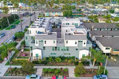 an aerial view of a large white house at Blocks To Beach - Coastal Beach Decor - Garage Parking - Gated Community - 30 Day Fully Furnished in Oceanside