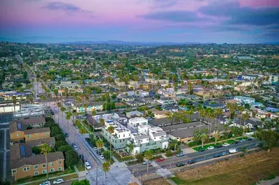 an aerial view of a city with buildings and cars at Blocks To Beach - Coastal Beach Decor - Garage Parking - Gated Community - 30 Day Fully Furnished in Oceanside