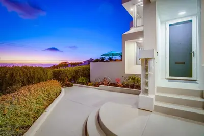 a walkway leading to a house with a view at Ultimate Getaway: Spa Game Rooms Firepit Views in San Diego