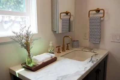 a bathroom counter with a sink and a window at La Jolla Beach Villa Gem in San Diego