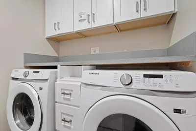 a laundry room with a washer and dryer at Endless Summer Beach Studio - Beach - AC - Shops in San Diego