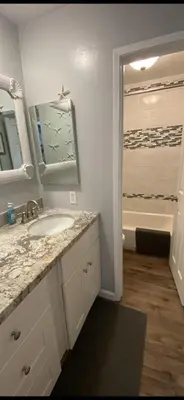 a bathroom with a sink and a bath tub at Ocean Breeze 2 bedroom in San Diego