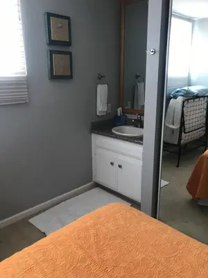 a bathroom with a sink and a mirror at Ocean Breeze 2 bedroom in San Diego