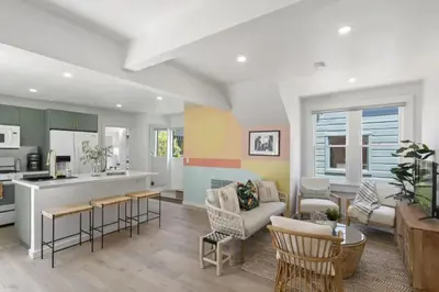 a kitchen and living room with a couch and chairs at 5BD Home with outdoor space in Little Italy in San Diego