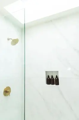 a bathroom with a shower with a glass door at Bright, Spacious 4 BD in the Heart of Little Italy in San Diego