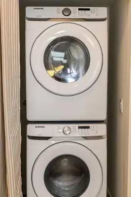 a washing machine and a dryer in a room at Bright, Spacious 4 BD in the Heart of Little Italy in San Diego