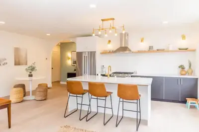 a kitchen with orange chairs and a white counter at Cheerful 4BD Home in the Heart in San Diego