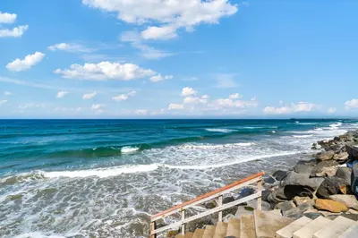 a view of the ocean from a rocky beach at Sunsets at the Beach House in Oceanside